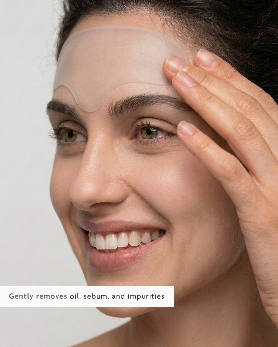 Pressing a hydrocolloid patch onto a forehead breakout