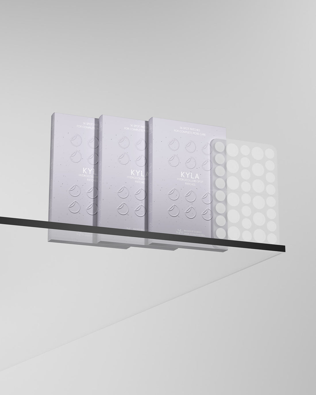 Three packs of KYLA hydrocolloid spot patches lined up